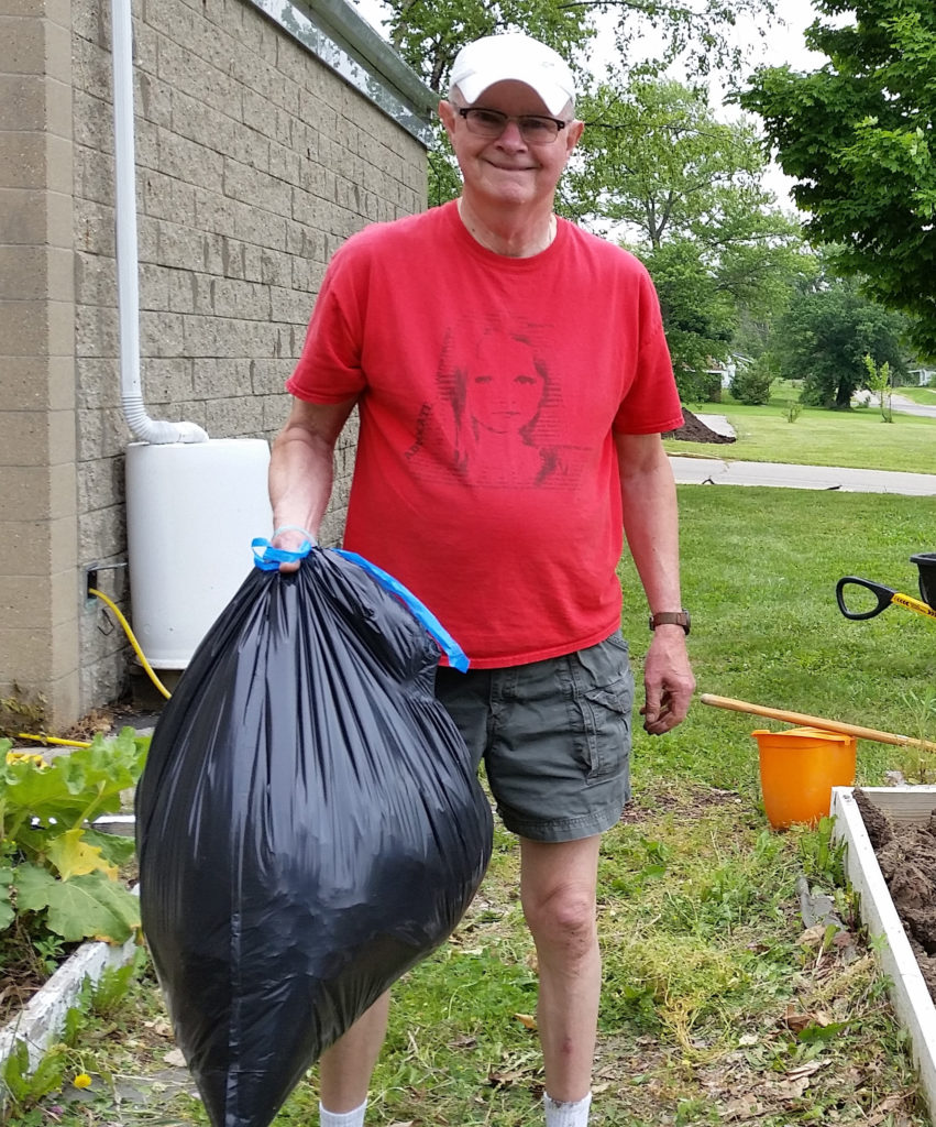 Ben gathering Garden Waste